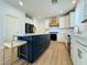 Well-equipped kitchen featuring stainless steel appliances, a large island with seating, and stylish finishes at 6495 Little Harbor Ct, Las Vegas, NV 89141