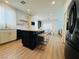 Modern kitchen featuring stainless steel appliances, marble countertops, island with seating, and ample storage at 6495 Little Harbor Ct, Las Vegas, NV 89141