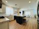 Open kitchen featuring a marble top island, stainless steel appliances, tile backsplash, and modern lighting at 6495 Little Harbor Ct, Las Vegas, NV 89141