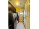 Functional laundry room with front loading washer and dryer, storage cabinets, and drying rack at 6495 Little Harbor Ct, Las Vegas, NV 89141