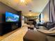 Spacious living room with modern decor, flat screen TV, and fireplace at 6495 Little Harbor Ct, Las Vegas, NV 89141
