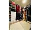Spacious walk-in closet with custom built-in shelving and plenty of storage space for clothes and accessories at 6495 Little Harbor Ct, Las Vegas, NV 89141