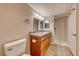 Bathroom features a granite counter, wood cabinet, tile floors and a shower-tub combo at 701 Capri Dr # 16B, Boulder City, NV 89005