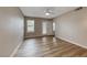 Spacious bedroom with wood-look floors, ceiling fan, and ample natural light at 701 Capri Dr # 16B, Boulder City, NV 89005