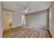 Bright bedroom with wood-look flooring, ceiling fan, and neutral paint at 701 Capri Dr # 16B, Boulder City, NV 89005