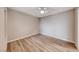 Bright bedroom with wood-look flooring and a ceiling fan at 701 Capri Dr # 16B, Boulder City, NV 89005