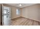 Well lit bedroom featuring wood look floors and a window offering bright, natural light at 701 Capri Dr # 16B, Boulder City, NV 89005