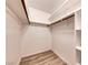 Walk-in closet with shelving and wood-look flooring at 701 Capri Dr # 16B, Boulder City, NV 89005