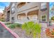 Exterior close up of complex buildings with well-manicured bushes and landscaping at 701 Capri Dr # 16B, Boulder City, NV 89005