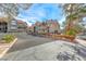 Complex exterior with red tile roof, green landscaping, and parking in front of buildings at 701 Capri Dr # 16B, Boulder City, NV 89005