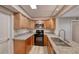 Well-lit kitchen with stainless steel appliances, granite countertops and ample cabinet space at 701 Capri Dr # 16B, Boulder City, NV 89005