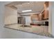 Modern kitchen featuring stainless steel appliances, granite countertops, and lots of cabinet space at 701 Capri Dr # 16B, Boulder City, NV 89005