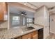 Updated kitchen featuring granite countertops, stainless steel sink, and modern appliances at 701 Capri Dr # 16B, Boulder City, NV 89005