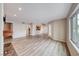 Spacious living room featuring wood floors, and lots of natural light from the large window at 701 Capri Dr # 16B, Boulder City, NV 89005