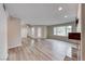 Living area with light wood flooring, fireplace, neutral paint, and natural light at 701 Capri Dr # 16B, Boulder City, NV 89005