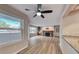 Welcoming living room featuring wood floors, fireplace and a kitchen view, providing a cohesive living space at 701 Capri Dr # 16B, Boulder City, NV 89005