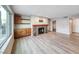 Open living area features light wood flooring, fireplace, wet bar, and outside balcony at 701 Capri Dr # 16B, Boulder City, NV 89005
