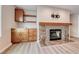 Stylish living room showcasing built-in shelves, fireplace and a granite bar, creating a cozy and sophisticated atmosphere at 701 Capri Dr # 16B, Boulder City, NV 89005