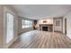 Living area featuring light wood flooring, fireplace, wet bar, and lots of natural light at 701 Capri Dr # 16B, Boulder City, NV 89005
