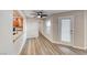 Charming living room featuring wood floors, ceiling fan and access to an outdoor patio at 701 Capri Dr # 16B, Boulder City, NV 89005