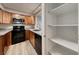 Kitchen with stainless appliances and pantry shelves for organized storage at 701 Capri Dr # 16B, Boulder City, NV 89005