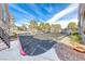 Designated uncovered parking area for residents with colorful landscaping at 701 Capri Dr # 16B, Boulder City, NV 89005