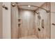 Bathroom featuring a tiled shower with built-in shelving and a rain shower head at 701 Capri Dr # 16B, Boulder City, NV 89005