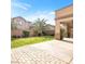 Serene backyard featuring a brick-paved patio, lush greenery, and shade trees, great for relaxation at 8216 Swallow Falls St, North Las Vegas, NV 89085