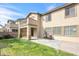 Private backyard with a well-maintained lawn, patio area, and lush landscaping; perfect for entertaining at 8216 Swallow Falls St, North Las Vegas, NV 89085