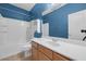 Bathroom featuring a vanity, toilet, combination tub and shower at 8216 Swallow Falls St, North Las Vegas, NV 89085