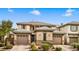 Charming two-story home featuring a three car garage, and desert landscaping at 8216 Swallow Falls St, North Las Vegas, NV 89085