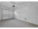Spacious garage with overhead storage racks and ample room for vehicle parking and storage at 8216 Swallow Falls St, North Las Vegas, NV 89085
