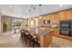Modern kitchen with a large island, stainless steel appliances, and an adjacent dining area at 8216 Swallow Falls St, North Las Vegas, NV 89085
