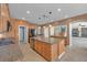 Open kitchen with granite countertops and stainless steel appliances; view extends to the living area at 8216 Swallow Falls St, North Las Vegas, NV 89085