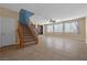 Spacious living room with staircase, large windows, and neutral decor at 8216 Swallow Falls St, North Las Vegas, NV 89085
