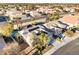 Expansive aerial perspective of a home with solar panels, mature landscaping, and community, showcasing a well-maintained property at 8354 Woodland Prairie Ave, Las Vegas, NV 89129