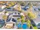 An aerial view of a beautiful home with a private pool, solar panels and lush landscaping at 8354 Woodland Prairie Ave, Las Vegas, NV 89129