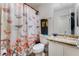 Bright bathroom featuring a butterfly shower curtain and marble countertop at 8354 Woodland Prairie Ave, Las Vegas, NV 89129