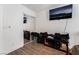 Bedroom with a sliding door mirrored closet and wall mounted TV at 8354 Woodland Prairie Ave, Las Vegas, NV 89129