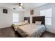 Comfortable bedroom with two beds, a ceiling fan, and modern vinyl plank flooring at 8354 Woodland Prairie Ave, Las Vegas, NV 89129