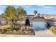 Charming single story home with a two car garage and desert landscaping at 8354 Woodland Prairie Ave, Las Vegas, NV 89129