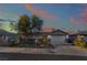 A beautiful single story home with desert landscaping, large driveway and a two-car garage at 8354 Woodland Prairie Ave, Las Vegas, NV 89129