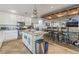 Well-equipped kitchen featuring stainless steel appliances and island with an open-concept design at 8354 Woodland Prairie Ave, Las Vegas, NV 89129