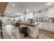 Bright, modern kitchen with an island, dining area and stainless steel appliances, perfect for cooking at 8354 Woodland Prairie Ave, Las Vegas, NV 89129