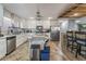 Contemporary kitchen with an island, ample counter space, and stainless appliances for modern convenience at 8354 Woodland Prairie Ave, Las Vegas, NV 89129