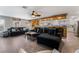 A living room featuring a cozy sofa and decor with a unique, open layout to the kitchen at 8354 Woodland Prairie Ave, Las Vegas, NV 89129