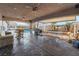 Covered patio area with ceiling fans, outdoor seating, and a grill at 8354 Woodland Prairie Ave, Las Vegas, NV 89129