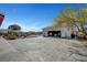 Detached two-car garage and spacious backyard with a custom concrete pad, mature trees, and plenty of room at 8365 Haven St, Las Vegas, NV 89123