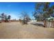 Expansive backyard highlighting a detached garage, providing ample space for various outdoor activities and landscaping ideas at 8365 Haven St, Las Vegas, NV 89123