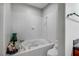 Bright bathroom featuring a soaking tub with tile surround and decorative elements at 8365 Haven St, Las Vegas, NV 89123